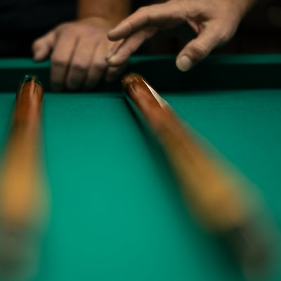 Carbon Fiber vs. Wood Pool Cue: Choosing Your Perfect Match in Billiards